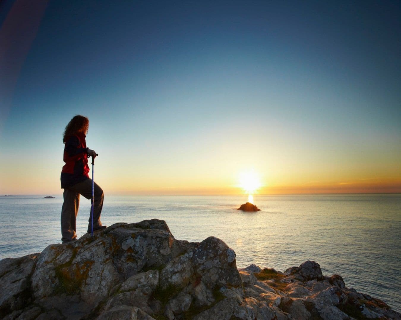 Hiker enjoying sunset on South West Coast path near Polzeath, Cornwall-min.jpg
